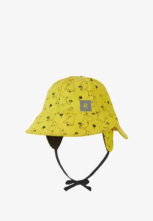 Żółty dziecięcy kapelusz typu bucket z czarnym wzorem kreskówkowego zwierzęcia, nausznikami i wiązanym paskiem pod brodą.