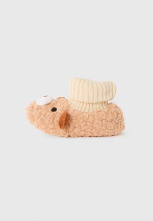 Weiche, beige Hausschuhe mit braunen Ohren und Augen, die wie ein Schaf gestaltet sind, mit einem cremefarbenen, gefalteten Rippbund.