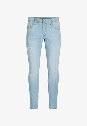 Világoskék, karcsúsított farmernadrág enyhe kopással a combokon, elöl gombos, cipzáras záródással és klasszikus öt zsebes kialakítással.