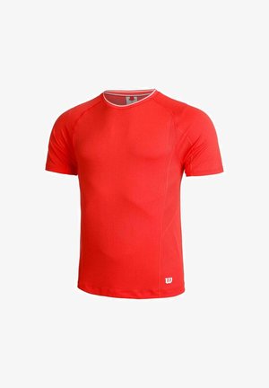 Red short-sleeve athletic shirt with a crew neckline, featuring mesh panels for ventilation and a white logo on the lower right side.