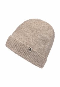 Wool beanie in a light beige color with a textured surface and a folded ribbed cuff. It features a small branded tag on the side.