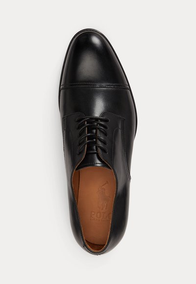 Black leather Oxford dress shoe with closed lacing, rounded toe, and tan insole featuring Polo Ralph Lauren logo.