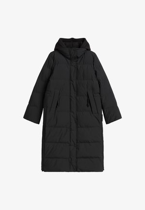 Long black padded winter coat with quilted stitching, front snap buttons, zippered pockets, ribbed hood lining, and side zippers.