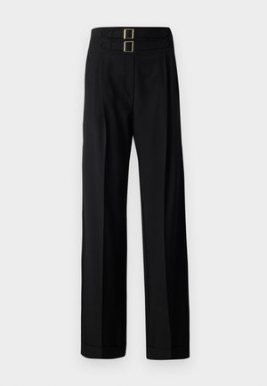 Black trousers featuring a high waistband with two rectangular gold buckles, wide-leg design, and a smooth, textured fabric.