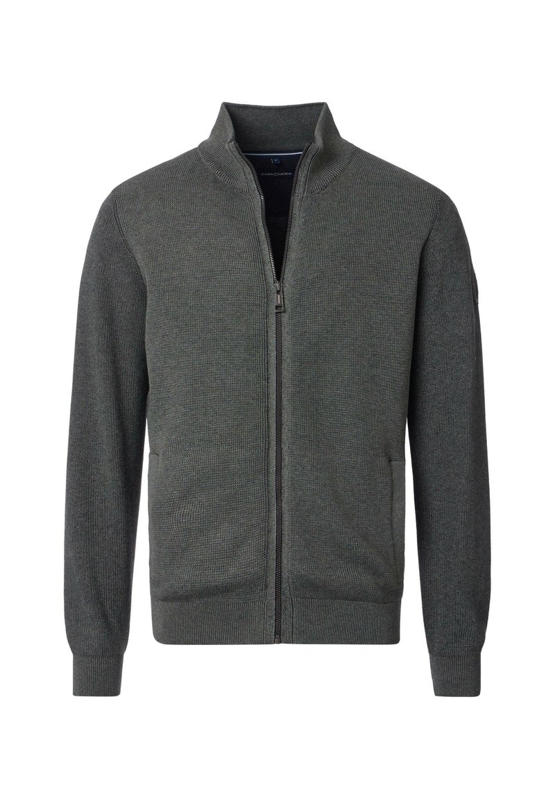 Dunkelgrüne Zip-Jacke mit hohem Kragen, gerippter Textur, langen Ärmeln und seitlichen Taschen. Verfügt über einen glatten Reißverschluss und enganliegende Manschetten.