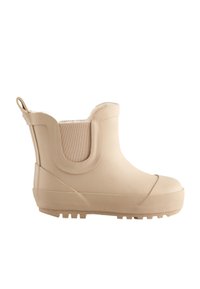 Botte de pluie en caoutchouc beige longueur cheville avec semelle texturée, panneau latéral élastique, languette arrière et doublure intérieure douce.