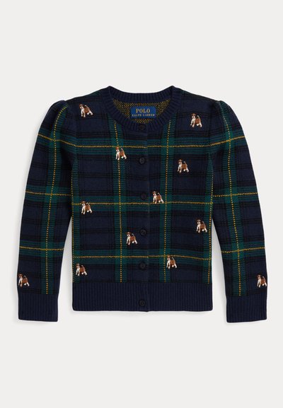 Jūras spēku kardigans ar zaļas un dzeltenas svītras rakstu, rotāts ar izšūtiem suņiem. Ribotās aproces un apakšmala, pogu aizdare priekšpusē un apaļa kakla izgriezums.