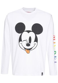 Hvid langærmet skjorte med et stort sort-hvidt Mickey Mouse grafik med en orange tunge. Regnbuefarvet tekst der står "MICKEY" på ærmet.