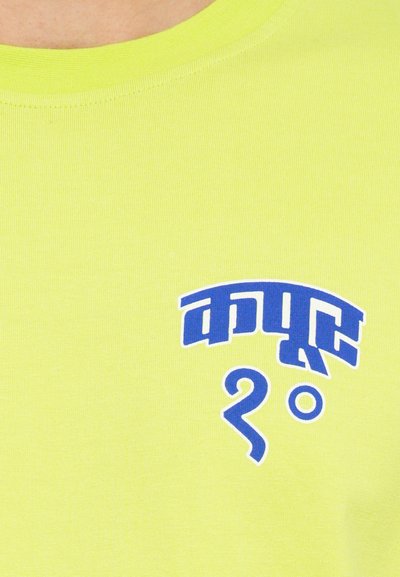 Neon yellow short-sleeve t-shirt featuring blue graphic text and a swirl design. The fabric appears smooth with a ribbed texture.