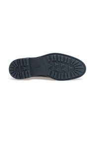 Sole in gomma nera con un motivo di battistrada testurizzato, caratterizzato da profonde scanalature per una migliore aderenza e un marchio del brand vicino al tallone.