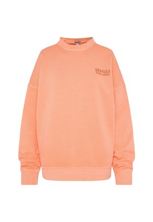 Oversized coral sweatshirt with a mock neck, dropped shoulders, ribbed cuffs, and a small logo on the chest in a contrasting shade.