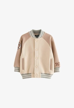 Béžová a piesková bombrová bunda s rebrovanými manžetami a golierom, zapínanie na patentky, bočné vrecká a vyšívaný detail na rukáve.