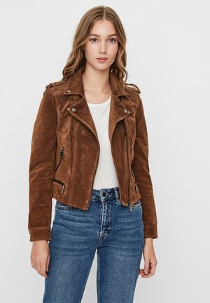 Brown suede biker jacket with zippered pockets and snap collar, paired with a white t-shirt and blue jeans. Smooth texture, fitted design.