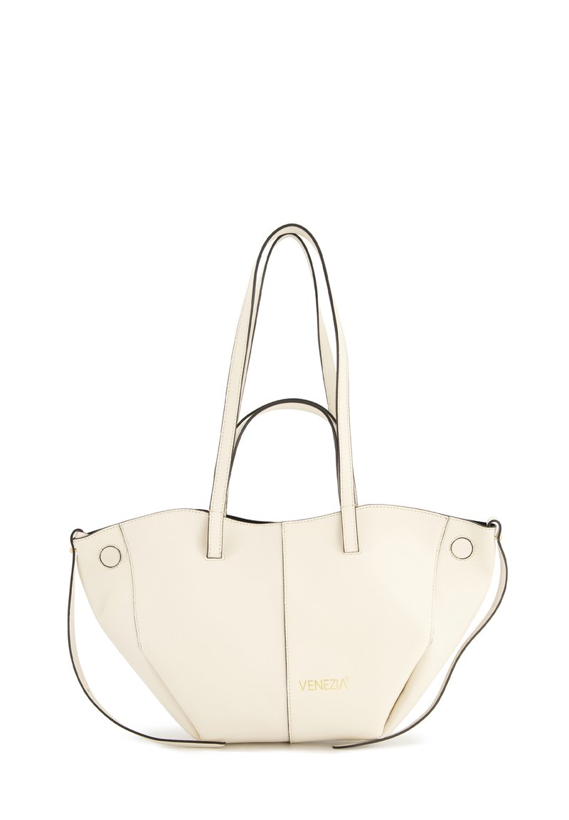 White leather tote bag with a unique shape, featuring dual handles and a detachable shoulder strap. Gold "Venezia" branding on front.