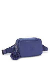 Blue fabric crossbody bag with two zippered compartments, featuring a circular logo and a purple gorilla keychain accessory.