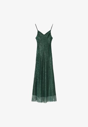 Robe longue sans manches vert foncé avec des fines bretelles et un superposition en maille à motifs en losange sur un fond blanc.