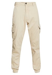 Beige cargo kalhoty se dvěma bočními kapsami, elastickými manžetami a knoflíkovým zapínáním. Vyrobeny z hladké, odolné tkaniny s běžným střihem.