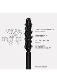 Brosse à mascara noire avec des poils ondulés de longueurs multiples et une pointe à fourche, conçue pour une application précise et une couverture complète des cils de la racine à la pointe.