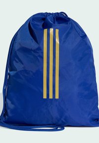 Modrý sáčok na zips vyrobený z lesklého nylonu s dvoma žltými pruhmi. Má zozbieraný vrch a textúrovaný povrch. Nastaviteľná modrá šnúrka.