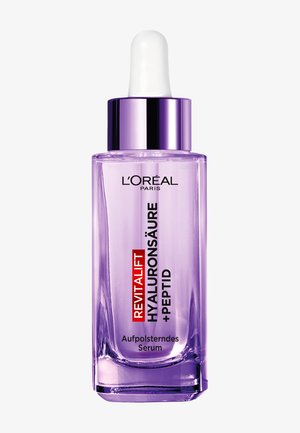Serum L'Oréal Revitalift z kwasem hialuronowym i peptydami w przezroczystej fioletowej butelce z zakraplaczem i srebrną nakrętką, oznaczone jako produkt nawilżający skórę.