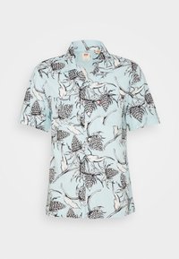 Camicia a maniche corte azzurro chiaro con motivo floreale in bianco e nero, colletto con bottoni e taschino sul petto. Tessuto morbido.