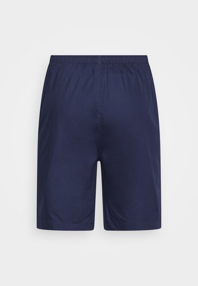 Navy blue shorts made of smooth fabric with an elastic waistband. Simple design, no pockets, and straight cut at the hem.