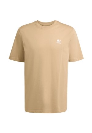 Beżowa bawełniana koszulka z krótkim rękawem, okrągłym dekoltem i białym logo Adidas na górnej lewej części klatki piersiowej. Prosty, gładki wzór bez nadruków.