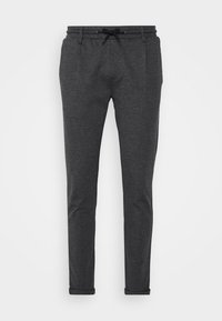 Pantalons gris foncé fuselés avec taille à cordon, fabriqués en tissu doux, avec des poignets retournés et des poches latérales.