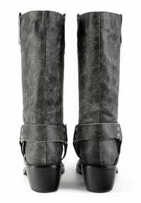 Black faux leather knee-high boots with a textured finish, featuring a strap with silver hardware, and a stacked heel for added height.