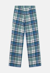 Kariierte Hosen mit einem elastischen Bund, gefertigt aus weichem Stoff, in den Farben Grün, Blau, Weiß und Marineblau, mit einem variierenden Rautenmuster.