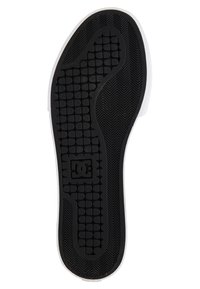 Black rubber sole with herringbone and hexagonal tread patterns; white side accents; DC logo prominently featured.