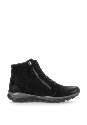 Black ankle boot with side zipper, laces, cushioned sole, and textured tread for casual or outdoor wear.
