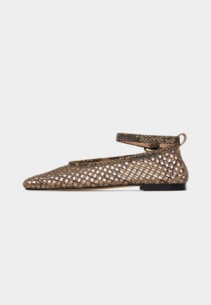 Pointed brown snake-patterned flat shoe with open mesh design and ankle strap with buckle on white background.