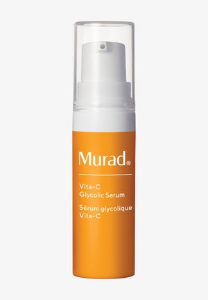Murad Vita-C Glycolic Serum in orangefarbener Flasche mit weißer Pumpe und klarem Verschluss, Text auf Englisch und Französisch auf dem vorderen Etikett.