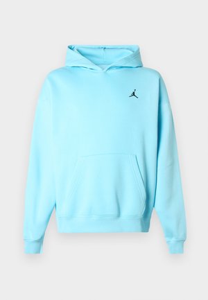 Gaiši zils kapucis ar priekšējo kabatu un mazu melnu Jumpman logo kreisajā krūtī, attēlots uz vienkārša fona.