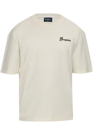 Beige bomulds T-shirt med korte ærmer, rund hals og "Dropsize" logo broderet i brun på venstre bryst. Løs pasform, glat tekstur.