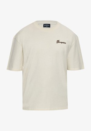 Beige puuvillane T-särk lühikeste varrukatega, ümmargune kaelus ja tumepruun "Dropsize" logo tikand vasakul rinnaosal. Mugav lõige, sile tekstuur.