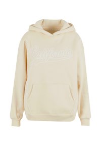 Krémový mikina vyrobená z mäkkej tkaniny, s prednou vreckom a bielym nápisom "California". Obsahuje kapucňu so šnúrkou a rebrované manžety.