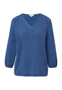 Blouse longue à manches longues bleu texturé avec un col en V et des poignets élastiques, taille 36, étiquette de marque visible à l'intérieur du col.