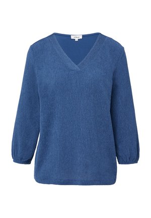 Blouse longue à manches longues bleu texturé avec un col en V et des poignets élastiques, taille 36, étiquette de marque visible à l'intérieur du col.