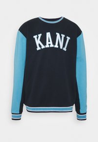 Felpa blu navy e azzurra chiara con "KANI" stampato in lettere bianche, colletto e polsini a costine con strisce orizzontali.