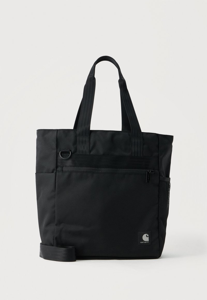 Μαύρη τσάντα tote Carhartt με δύο λαβές, μπροστινή τσέπη με φερμουάρ, πλαϊνή τσέπη από δίχτυ και ρυθμιζόμενο ιμάντα ώμου.