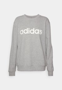 Ljust grå långärmad sweatshirt med rund halsringning och "adidas"-logotyp tryckt i vitt över bröstet, ribbade ärmslut och nederkant.