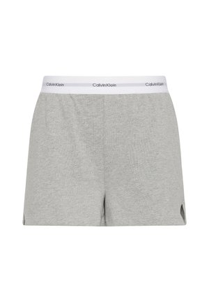 Szare bawełniane szorty z białym elastycznym pasem w talii ozdobionym logo "Calvin Klein". Zaprojektowane z bocznymi rozcięciami dla wygody i przewiewności.