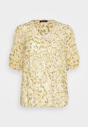 Lahka bluzica s kratkimi rokavi v kremni, rumeni in zeleni abstraktni vzorec. Ima V-izrez, zapiranje z gumbi in eno žep na prsih.
