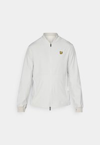 White zip-up jacket with a stand-up collar, two side pockets, and a small yellow logo on the left chest. Soft, smooth fabric texture.
