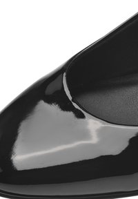 Black patent leather shoe with a pointed toe and smooth, glossy finish, featuring a low cut design and a textured inner lining.