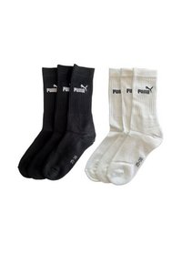 Drei Paar schwarze und drei Paar weiße Puma Crew-Socken mit gerippten Bündchen und Logo am Knöchel, Größe 35-38.