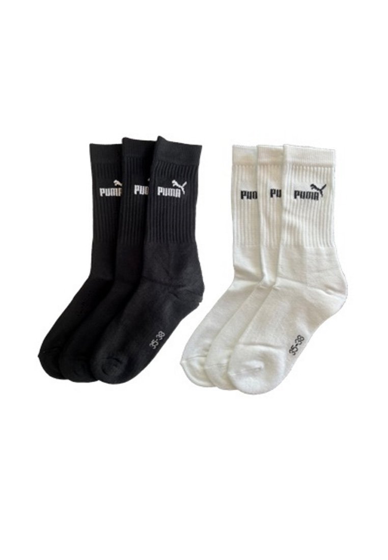 Drei Paar schwarze und drei Paar weiße Puma Crew-Socken mit gerippten Bündchen und Logo am Knöchel, Größe 35-38.