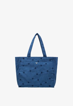 Blauwe corduroy draagtas met geborduurde donkerblauwe bloemmotieven en twee schouderbanden op een witte achtergrond.